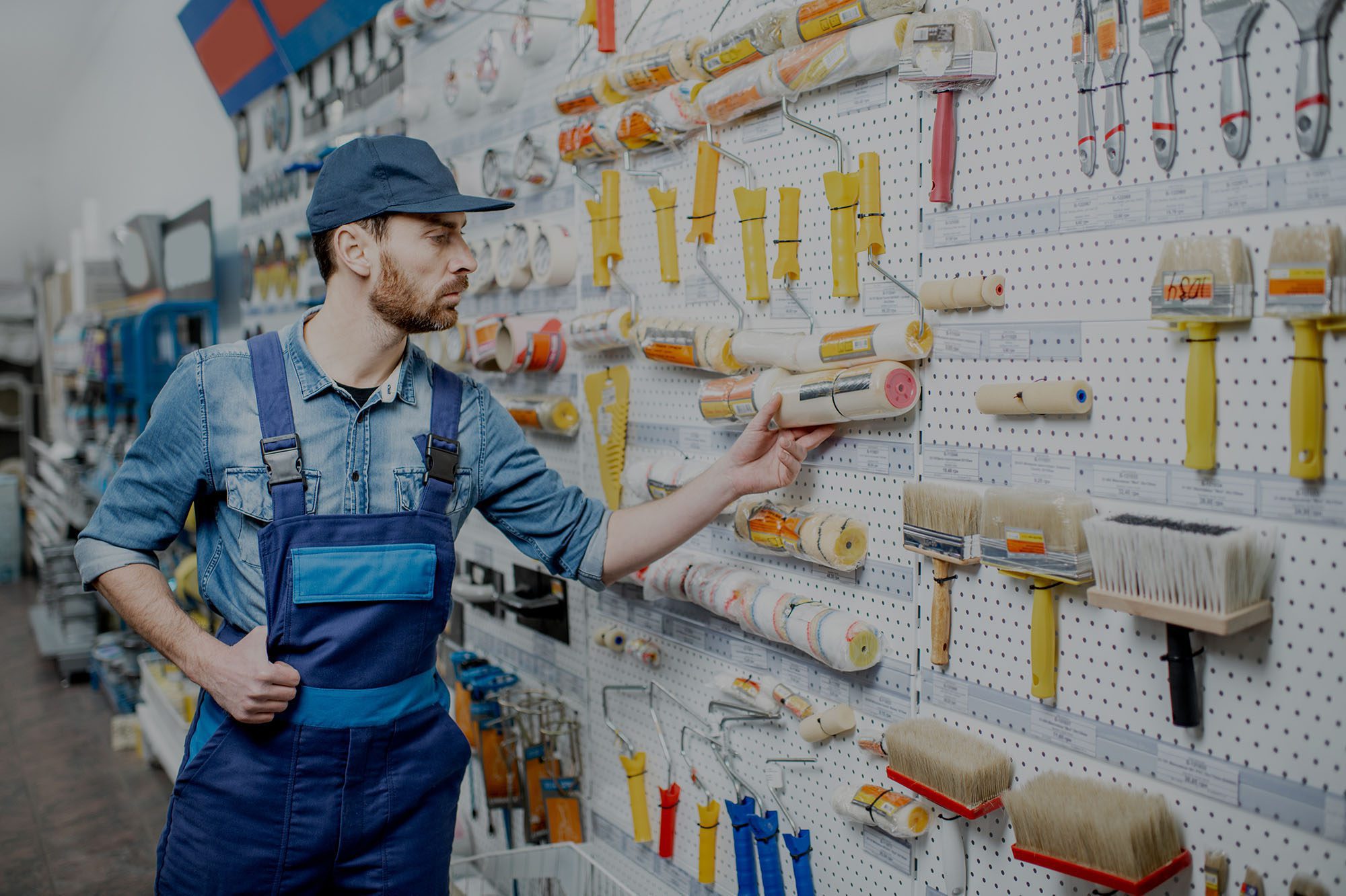 Person in a store picking up tools