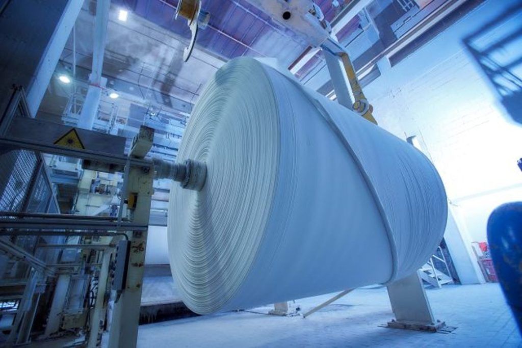 a picture of a paper machine - indicating paper roll logistics automation