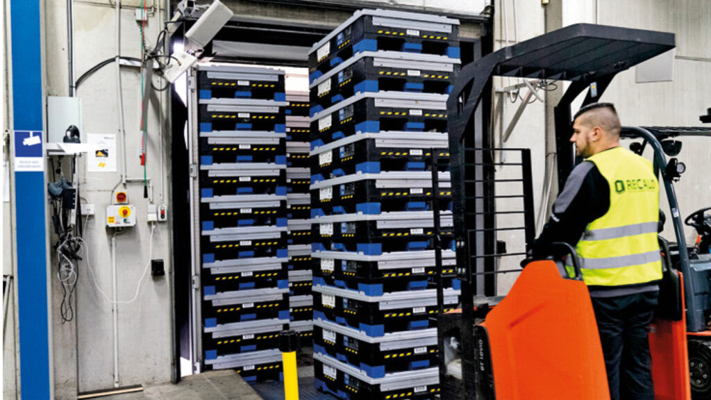 Plastic RTIs are being loaded through an RFID gate for tracking purposes