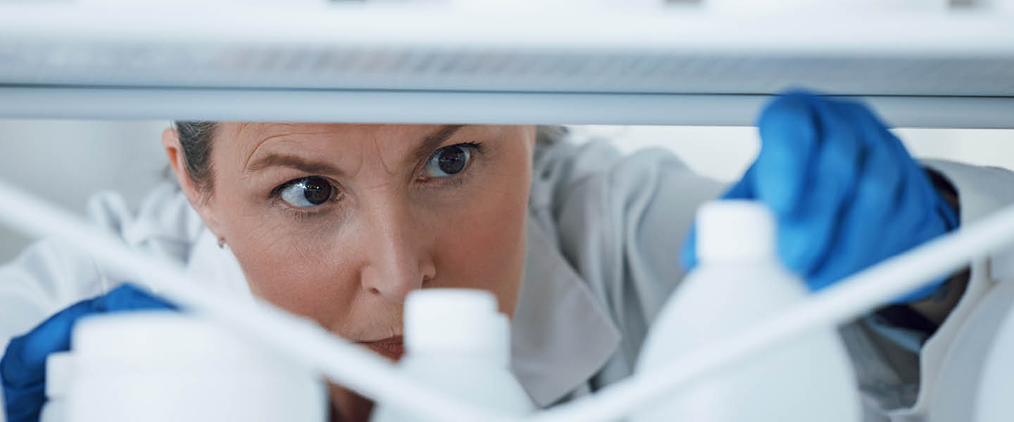 A person looking for medicines in a stock room