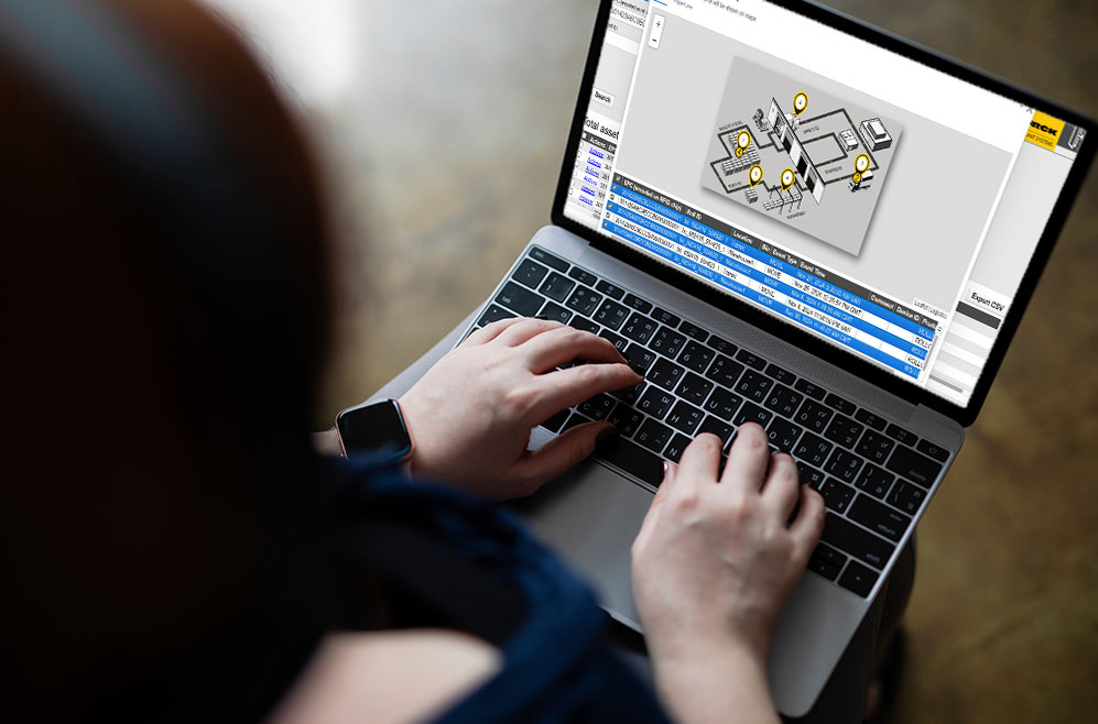 Person sits in front of computer looking at asset spread on a map view in a track and trace middleware
