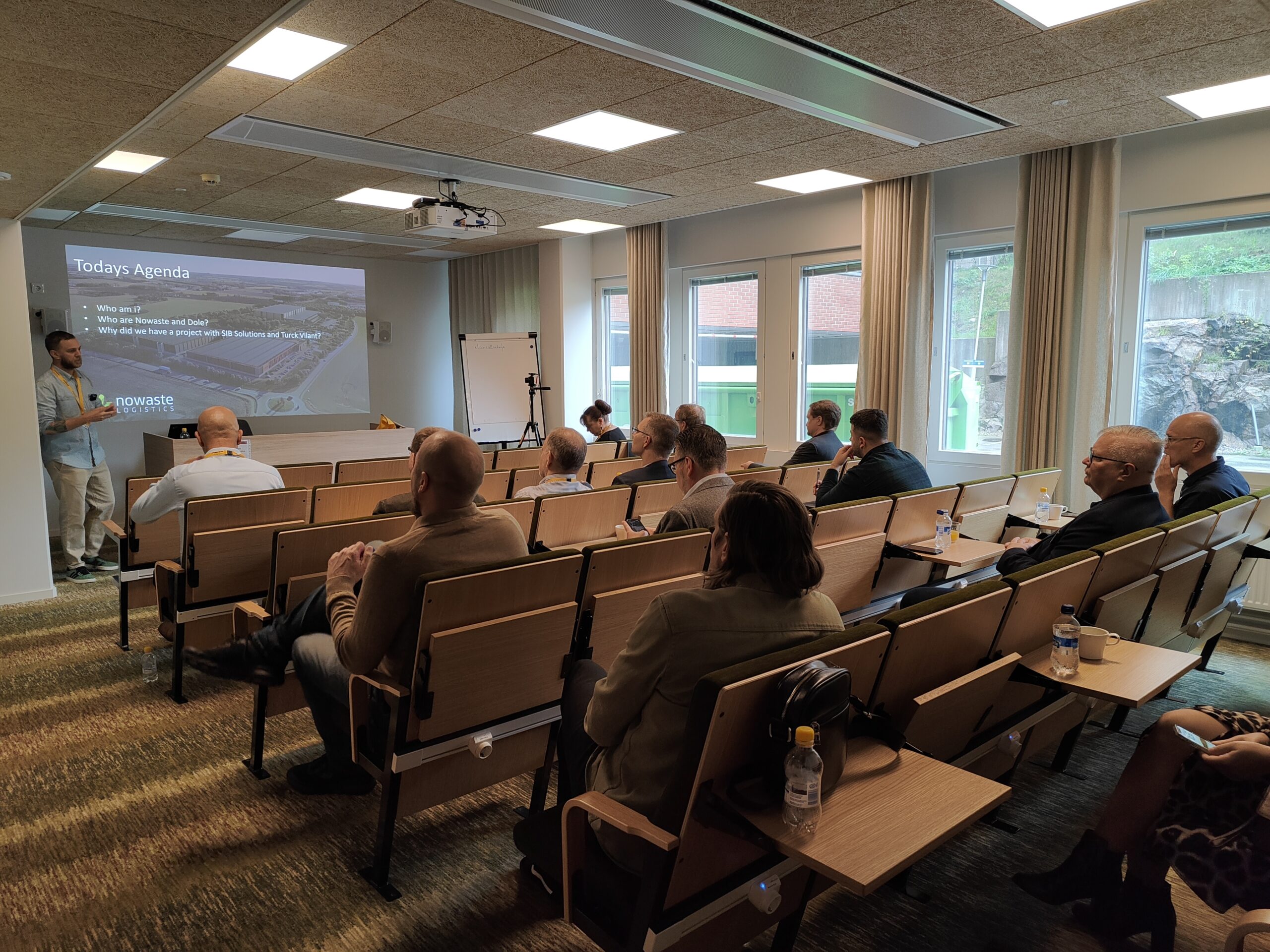 people sitting hearing a presentation