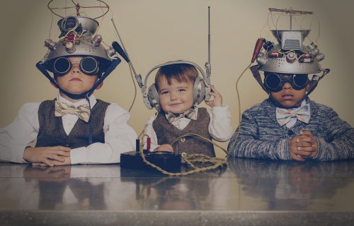 RFID and RTLS consultancy and planning 3 kids wearing funny radio areals etc on their heads - depicting the superstitions people have about radio, yet describing Turck Vilant Systems pioneer attitude