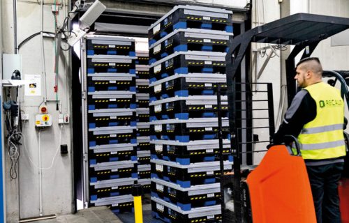 Plastic RTIs are being loaded through an RFID gate for tracking purposes