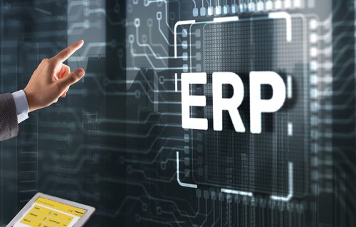 Turck Vilant Systems integrates RFID middleware to customer ERP and other systems A person pushing a wall that looks like an IC board and has ERP in the middle - this is to depict integratation of RFID middleware to customer ERP and other systems